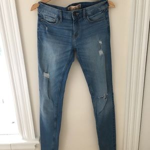 Light wash slightly ripped skinny jeans